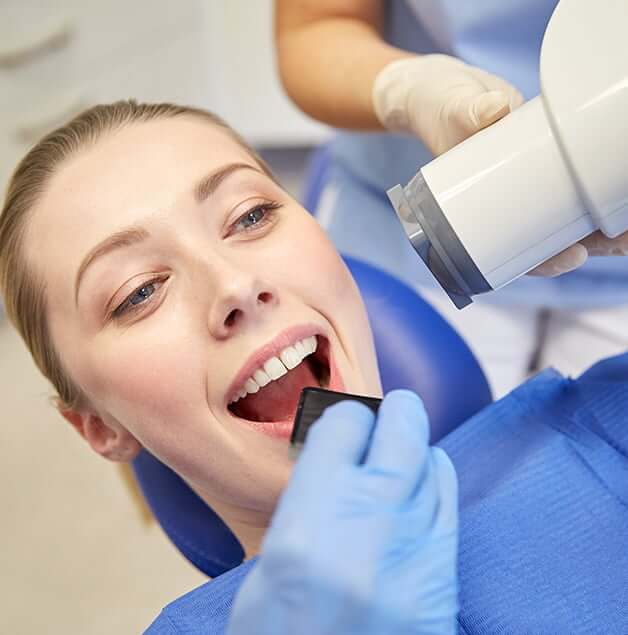 woman receiving dental x-rays