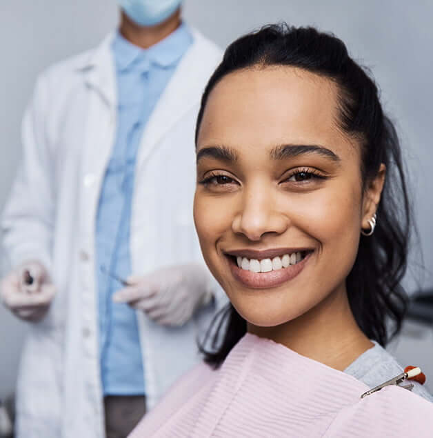 smiling woman sitting in a dental chair