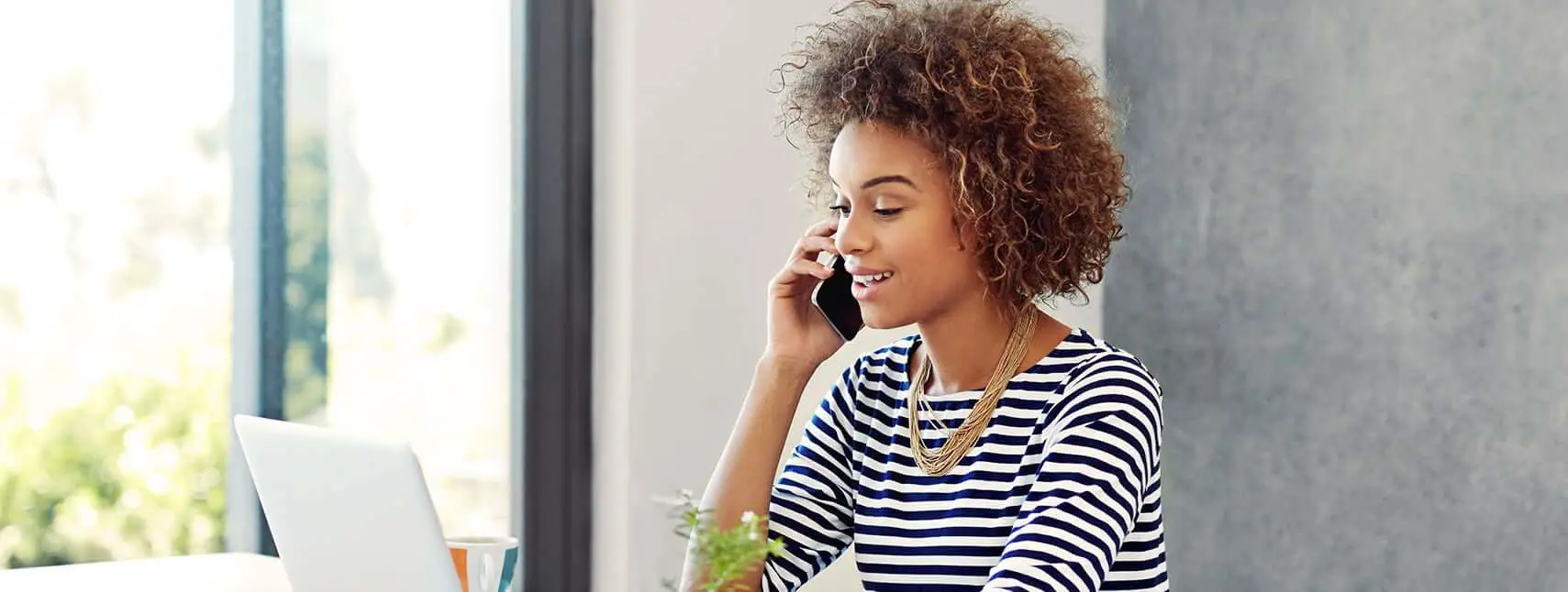 woman talking on the phone, dental office in johnson city, dental office
