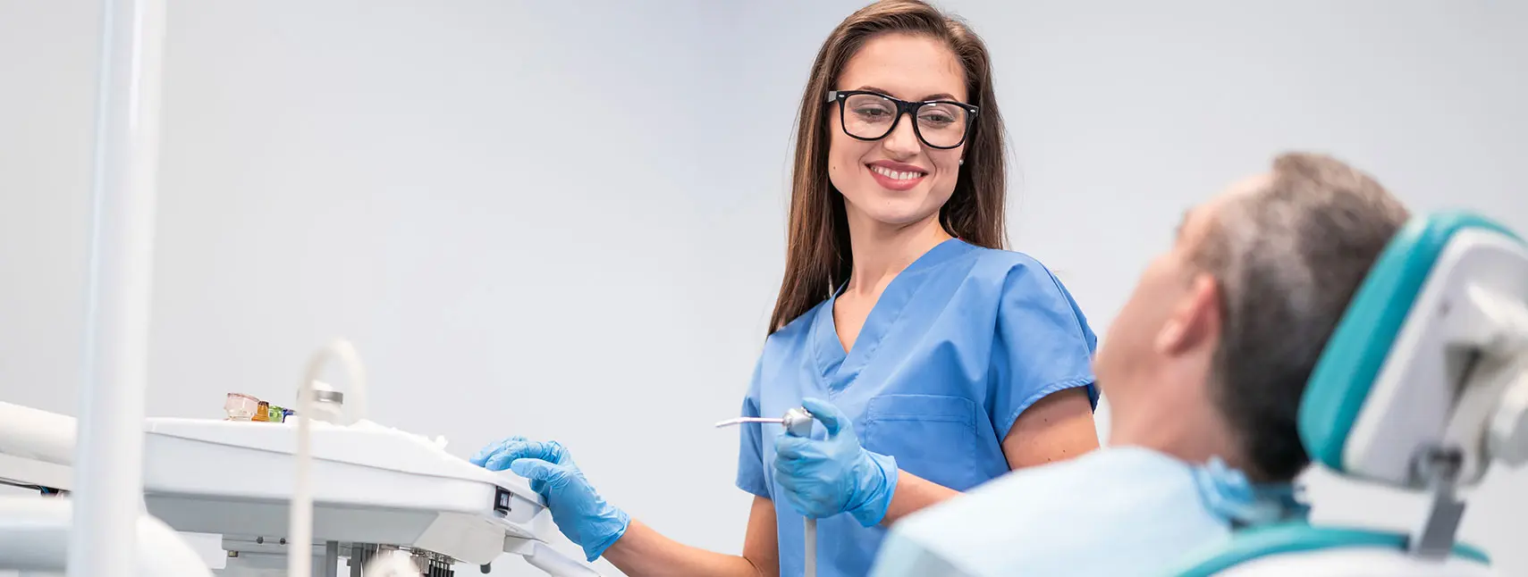dental hygienist and patient in dental office about to do a routine dental cleaning and exam, johnson city tn