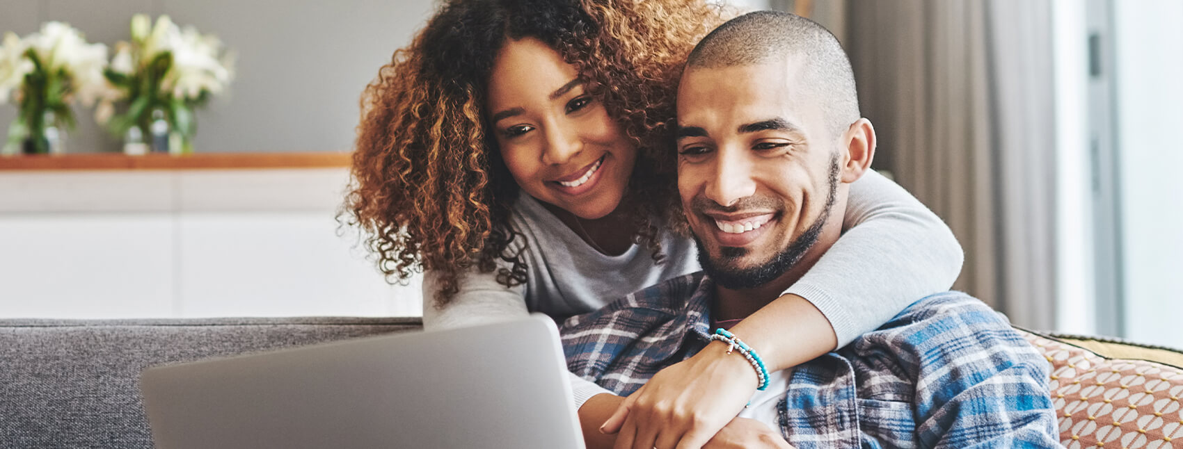 couple looking at a laptop together