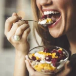 woman eating yogurt for strong teeth with great nutrition